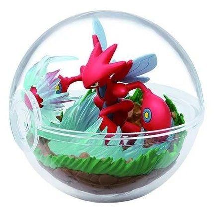 A red Pokémon figurine is displayed inside a transparent glass ball, surrounded by a miniature landscape with green grass and rocks.