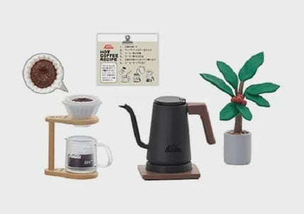 various coffee-related items, including a coffee pot, a coffee mug, a coffee strainer, a coffee bowl, a coffee plant, and a sign.