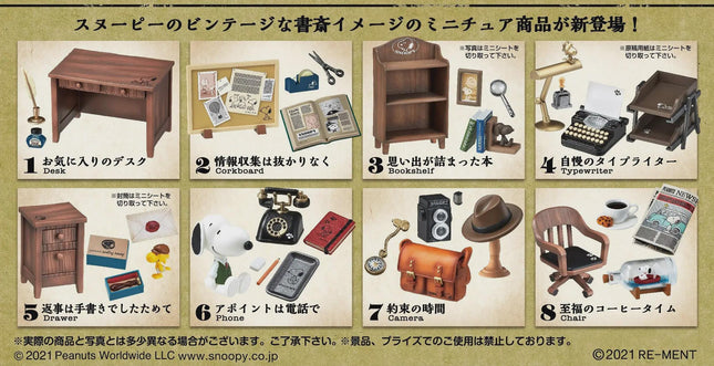 The image is a collage of various miniature items, including a desk, typewriter, telephone, camera, and other objects, arranged in a grid format.