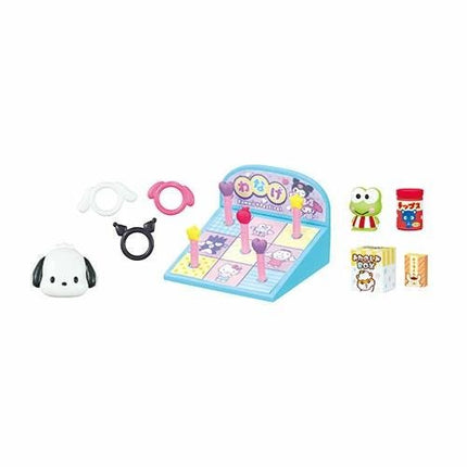 A collection of various colorful toys, including a stuffed animal, a toy cash register, and other playful items, arranged on a white background.