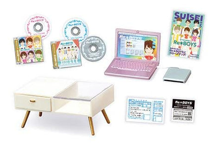 various items related to the "Suisei Ren Boys" music group, including CDs, a laptop, a white table, and some other miscellaneous objects.