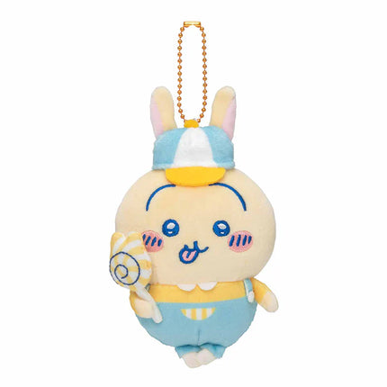 Mini plush mascot with pale-yellow body, blue cap, holding spiral, hanging chain