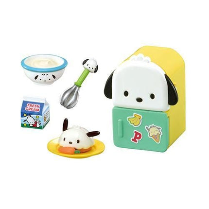 a variety of colorful toys and food items, including a toy refrigerator, a bowl, a spoon, a carton of milk, and a small doll.