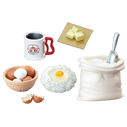 various baking ingredients, including a cup, a bowl of eggs, a bag of flour, a bag of sugar, a bag of butter, a bag of yeast, and a bag of salt.