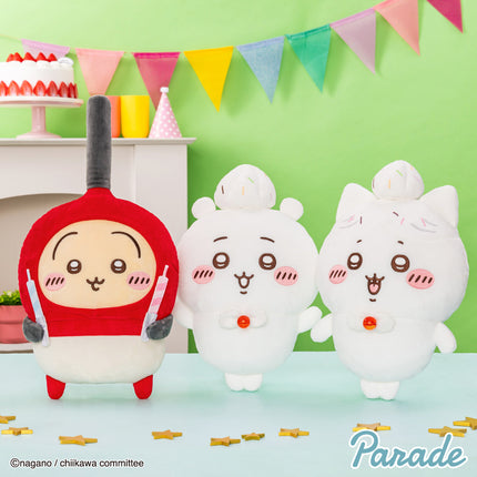 Three big plush toys: one red character with ear muffs and two white cat-like plushes.