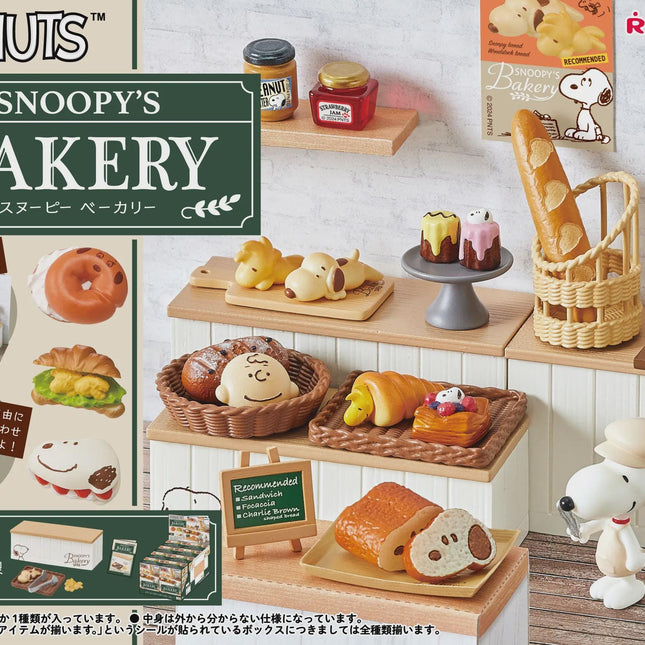 Peanuts bakery miniatures display box with shelf items, pastries, candles, and basket