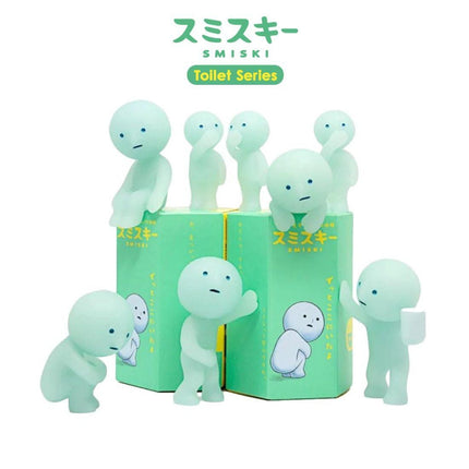 A collection of seven small, light green figurines resembling ghostly or translucent figures, arranged in a group.