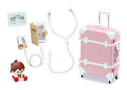 various items, including a pink suitcase, a stethoscope, a small toy, and a wallet.
