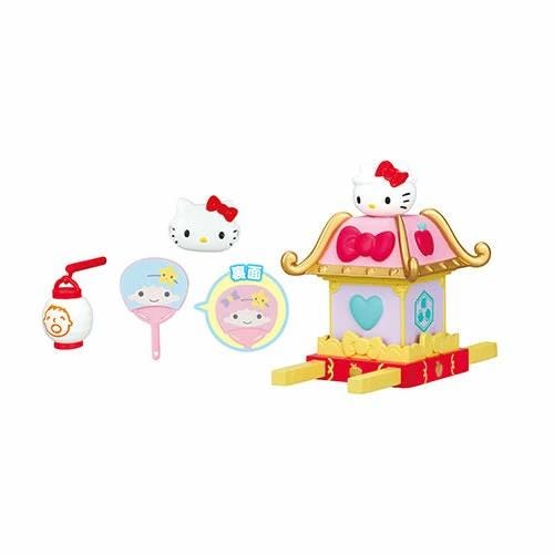 a hello kitty doll house with accessories on a white background