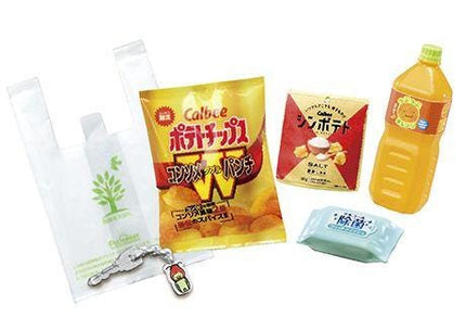 various food and drink items, including a plastic bag, a bag of chips, a bottle of orange juice, a keychain, and a package of salt.