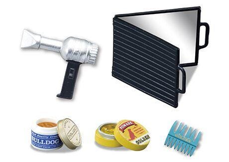 a hair dryer, a mirror, a blue comb, and a small container of hair product.
