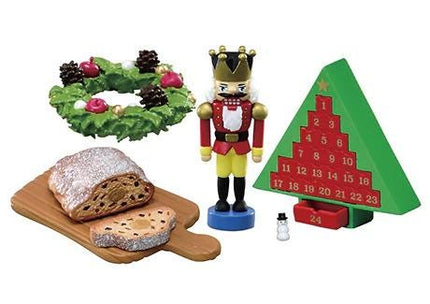 a nutcracker figure, a nutcracker tree, a loaf of bread, and a calendar.