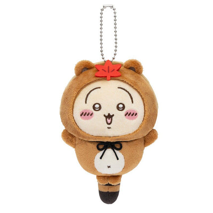 Tanuki keychain plush with silver chain, tan fur, white belly pouch, and red star on top