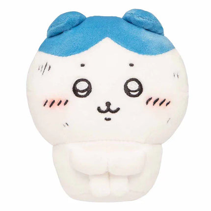 Front view plush toy with white body, blue cap, black eyes, and whiskers