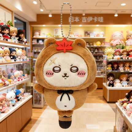 Tanuki series plush keychain, round brown mascot with white face and red leaf on top