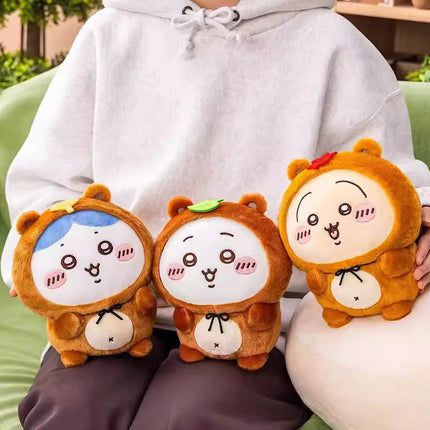 Tanuki series plush toys in tan, orange, and brown with white faces and black bows
