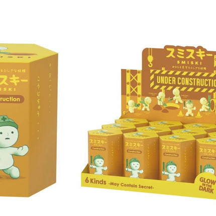 Smiski Construction series blind box packaging with small green toy figure, under construction scene