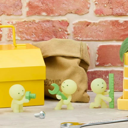Smiski Construction Series blind box figures with yellow tool box, tape measure, and cone