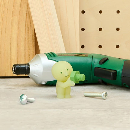 Smiski Construction Series blind box figure holding a green tool hammer