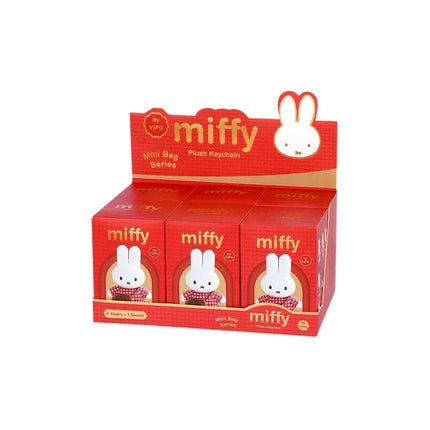 Display of Miffy plush keychain boxes with red packaging and white bunny design.