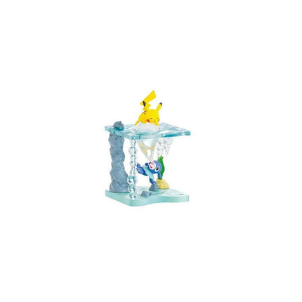 A small figurine of Pikachu, a popular Pokémon character, is displayed on a blue and green base.