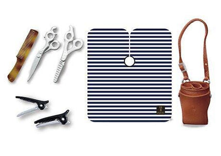 various hair care and beauty products, including scissors, a comb, a hairbrush, a hair tie, and a purse.