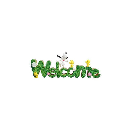 A welcome sign made up of the word "Welcome" in a playful, cartoon-like style, with various cartoon characters such as Peanuts characters integrated into the design.