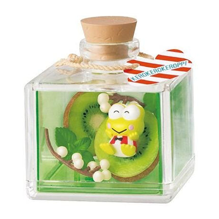 A glass bottle containing a green liquid, with a small yellow figurine of a character inside.