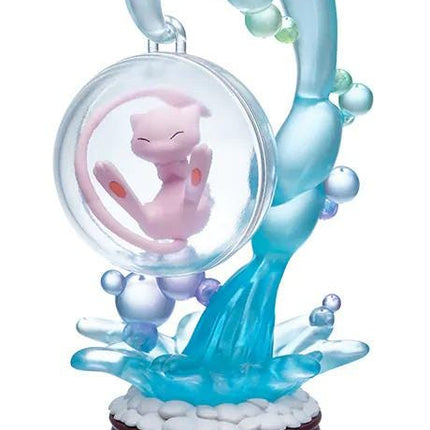 A figurine of Pikachu, a popular Pokémon character, is displayed on a base with a bubble-like structure and a blue and white color scheme.
