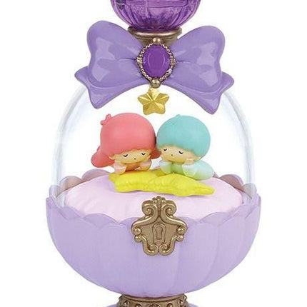 A purple perfume bottle with a purple bow and a purple gemstone. Inside the bottle, there are two small figurines, one pink and one blue, sitting on a yellow flower.