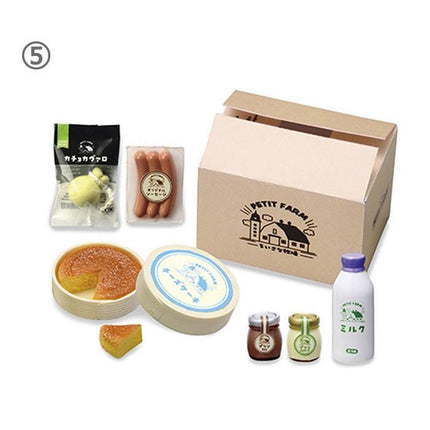 various food items and packaging, including a carton, a bottle, a jar, a cake, and some condiments.