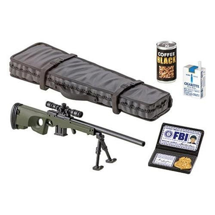 a toy gun, a case, a can of coffee, a pack of cigarettes, and a badge with the FBI logo.
