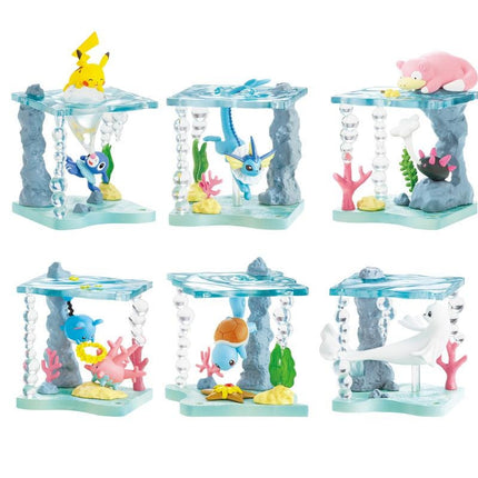 A collection of six colorful and whimsical Pokemon figurines, each depicting a different aquatic creature, set against a backdrop of underwater elements.