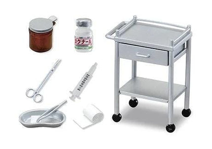 various medical supplies and equipment, including a medical cart, syringe, scissors, bandages, and other items typically found in a medical setting.
