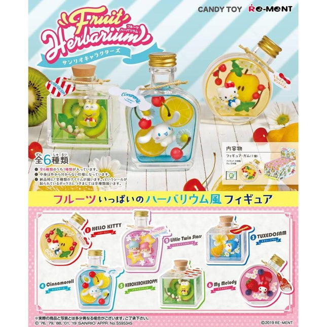 The image is a colorful advertisement featuring various fruit-themed collectible figurines and bottles, likely intended as a candy toy product.