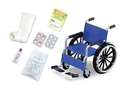 a blue wheelchair, a cast, pills, and a note, all arranged on a white background.