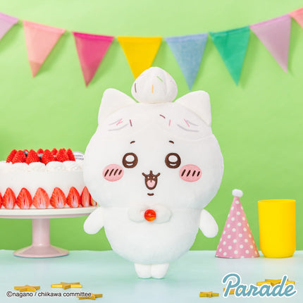 White big plush toy with bow ears, cat face, and a red button on belly.