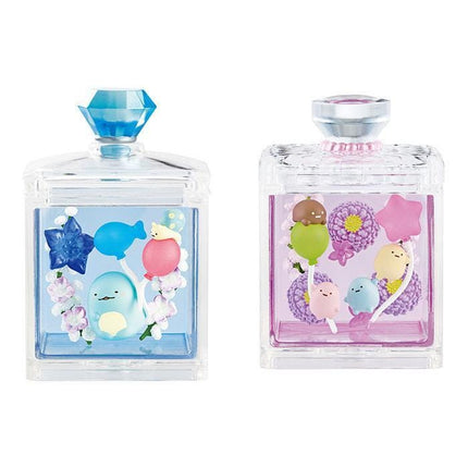 two clear glass containers with colorful designs and decorations inside them.