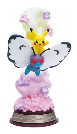A figurine of Pikachu and a butterfly, with Pikachu riding on the back of the butterfly, is depicted in the image.