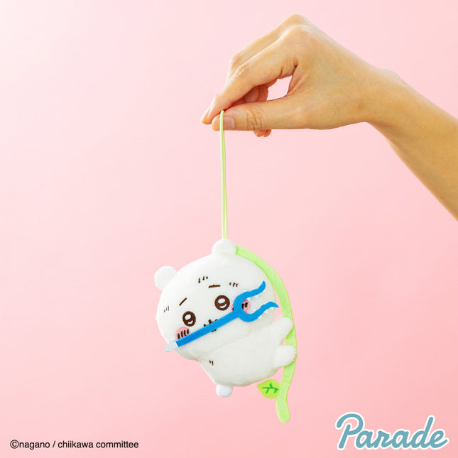 Hand-held plush mascot keychain, white character with blue band and green strap