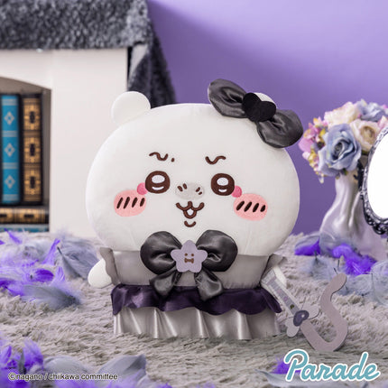 Round panda-like plush toy with black bow, purple ruffle skirt, and soft white face