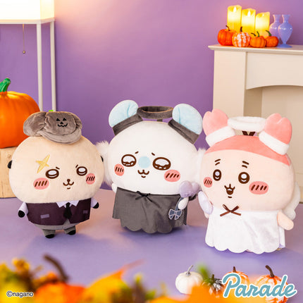 Three big plush toys: gray, white panda, and pink bunny in hooded outfits