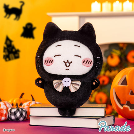 Black cat plush toy with cute face and white bow tie