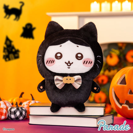 Black cat plush toy standing upright with tan bow tie