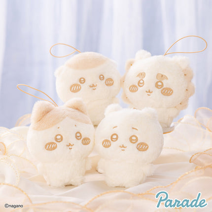 Milk-colored plush mascot set of four with stitched face and small loop straps