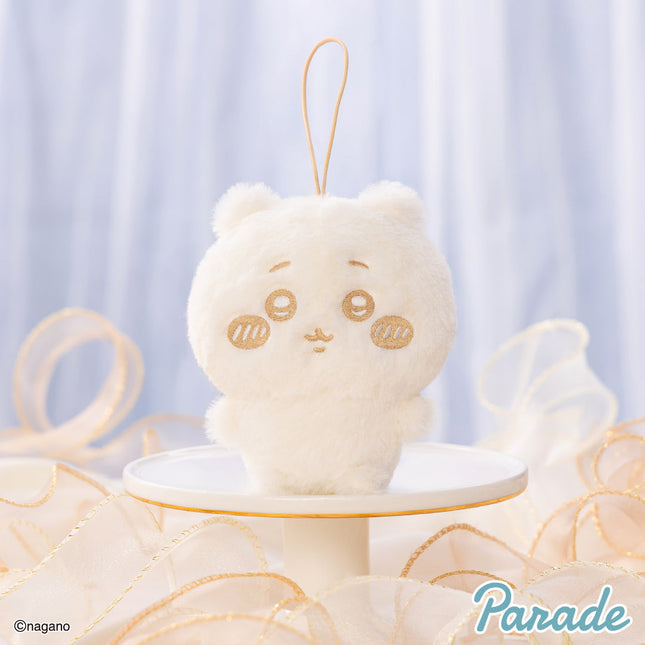 Milk-colored plush mascot keychain with stitched face, wearing a loop strap