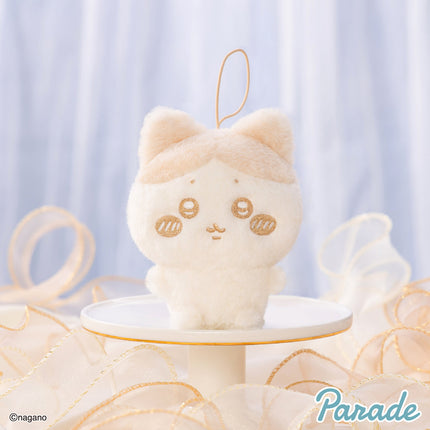 Milk-colored plush mascot keychain with loop strap, stitched face and rounded ears