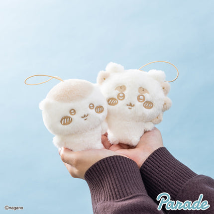 Milk-colored plush mascot pair with loop straps in hands, stitched faces and ears