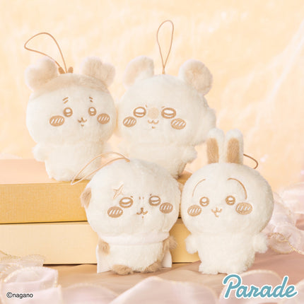 Set of three light cream plush mascots with long ears and stitched faces