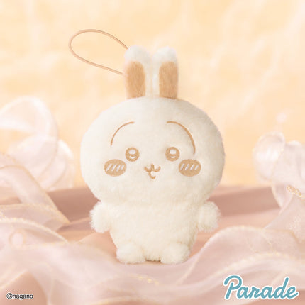 Light cream plush mascot with long ears and stitched face, standing upright